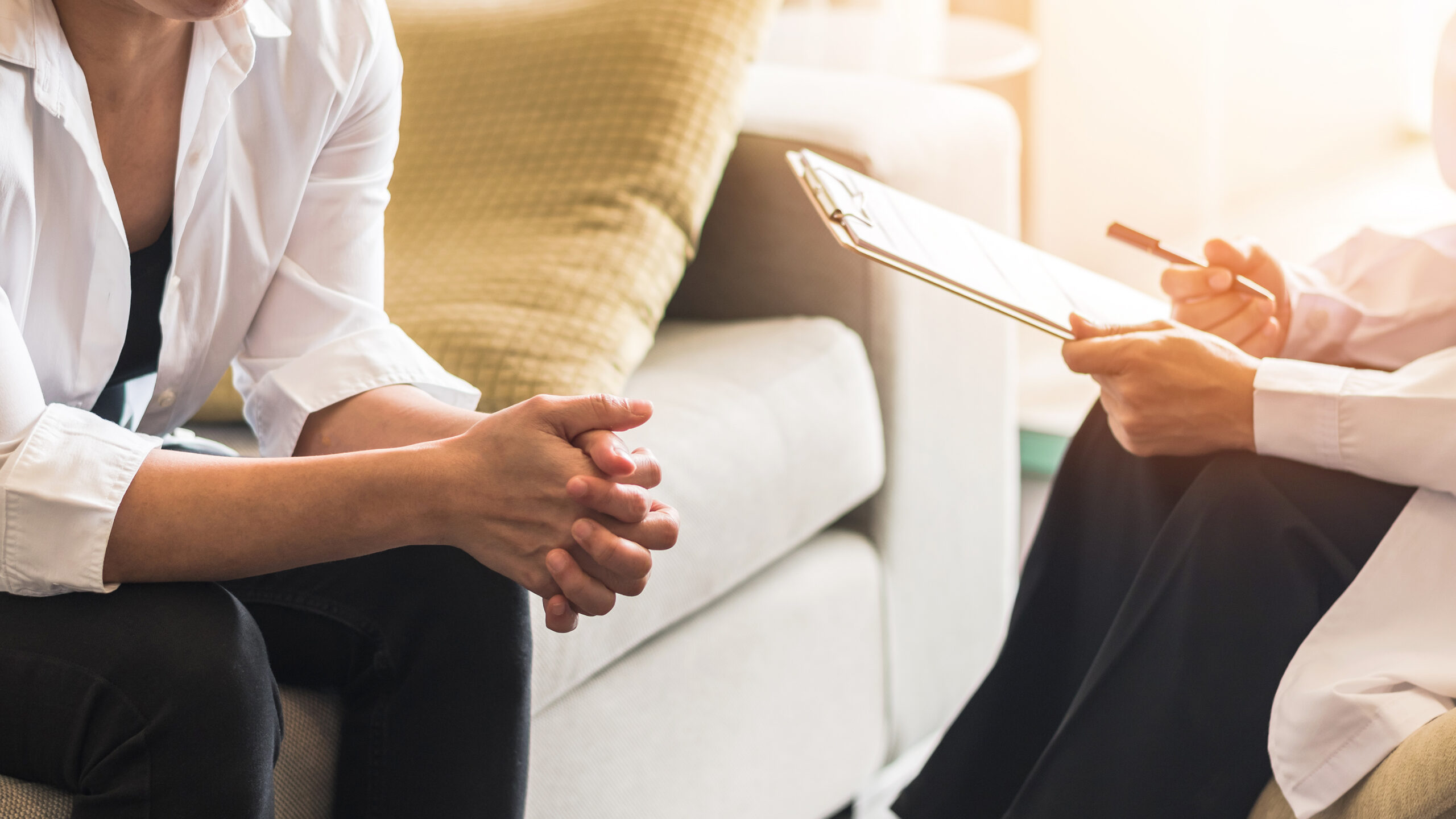 Two individuals sit in a room during a trauma therapy session. They are in their first appointment for trauma therapy in Forest Hills, NY with trauma therapist Deborah Karnbad. You can also get online therapy in New York to deal with your trauma.