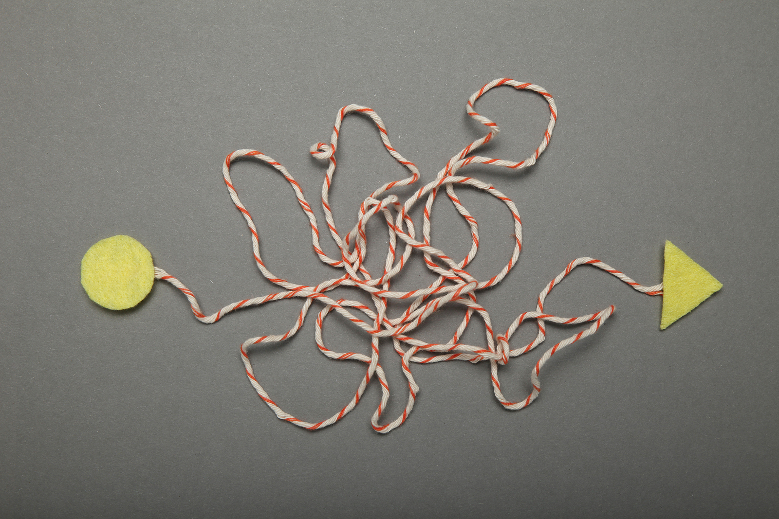 A tangled string represents the difficult decisions one has to make before pursuing counseling for divorce recovery in New York with Deborah Karnbad. 